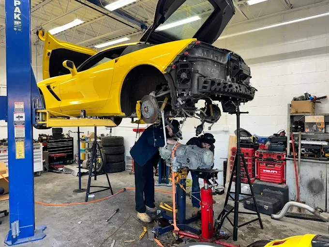 Beach Auto & Transmission Repair technician servicing a transmission on a lifted sports car in our Virginia Beach shop