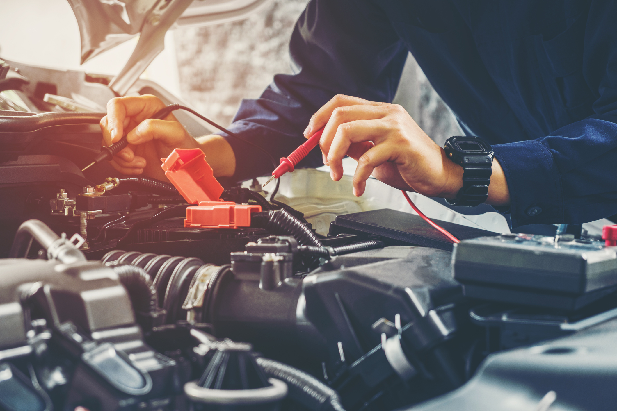 A battery's voltage being checked