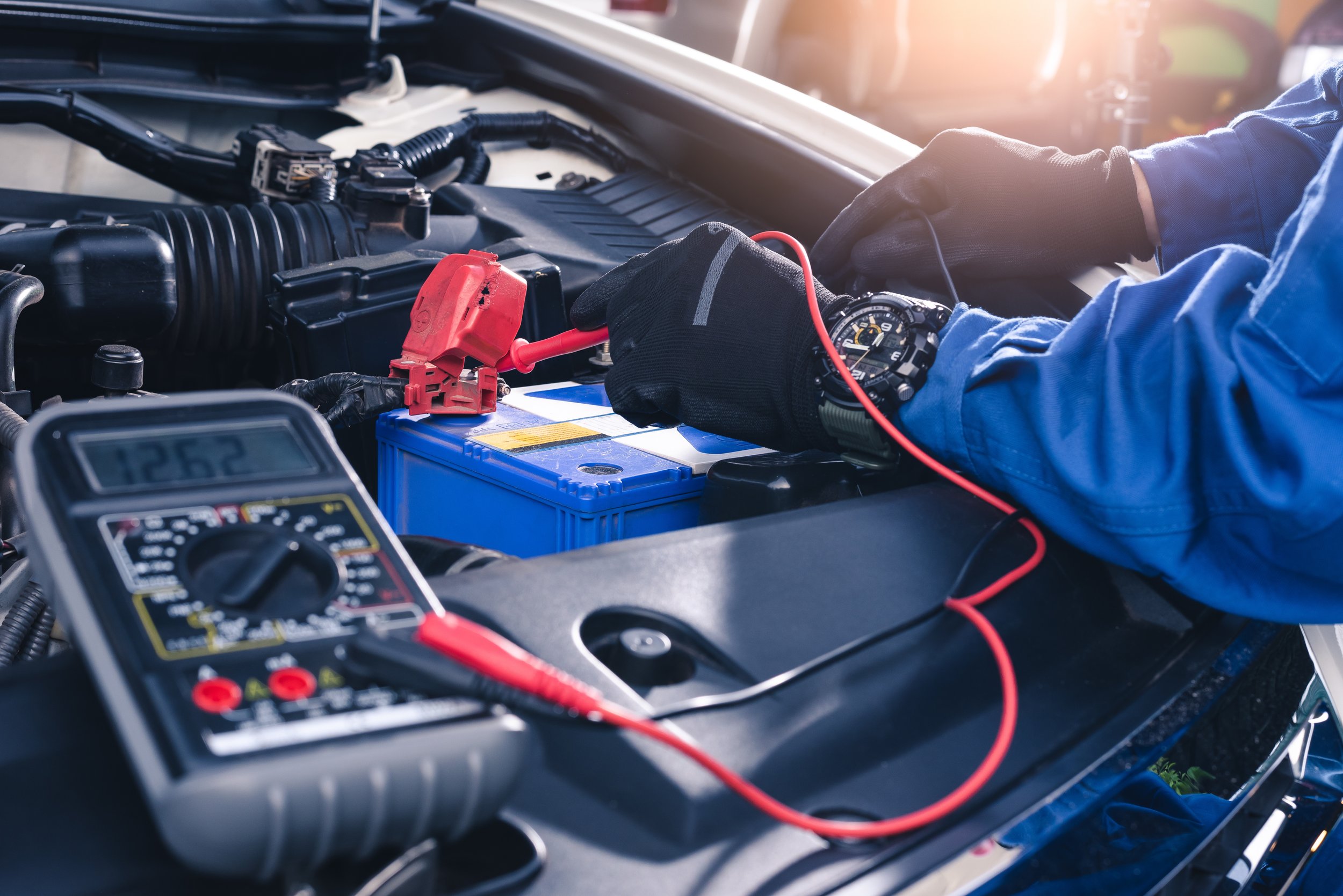 A battery's voltage being checked