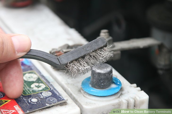 Battery terminals being cleaned