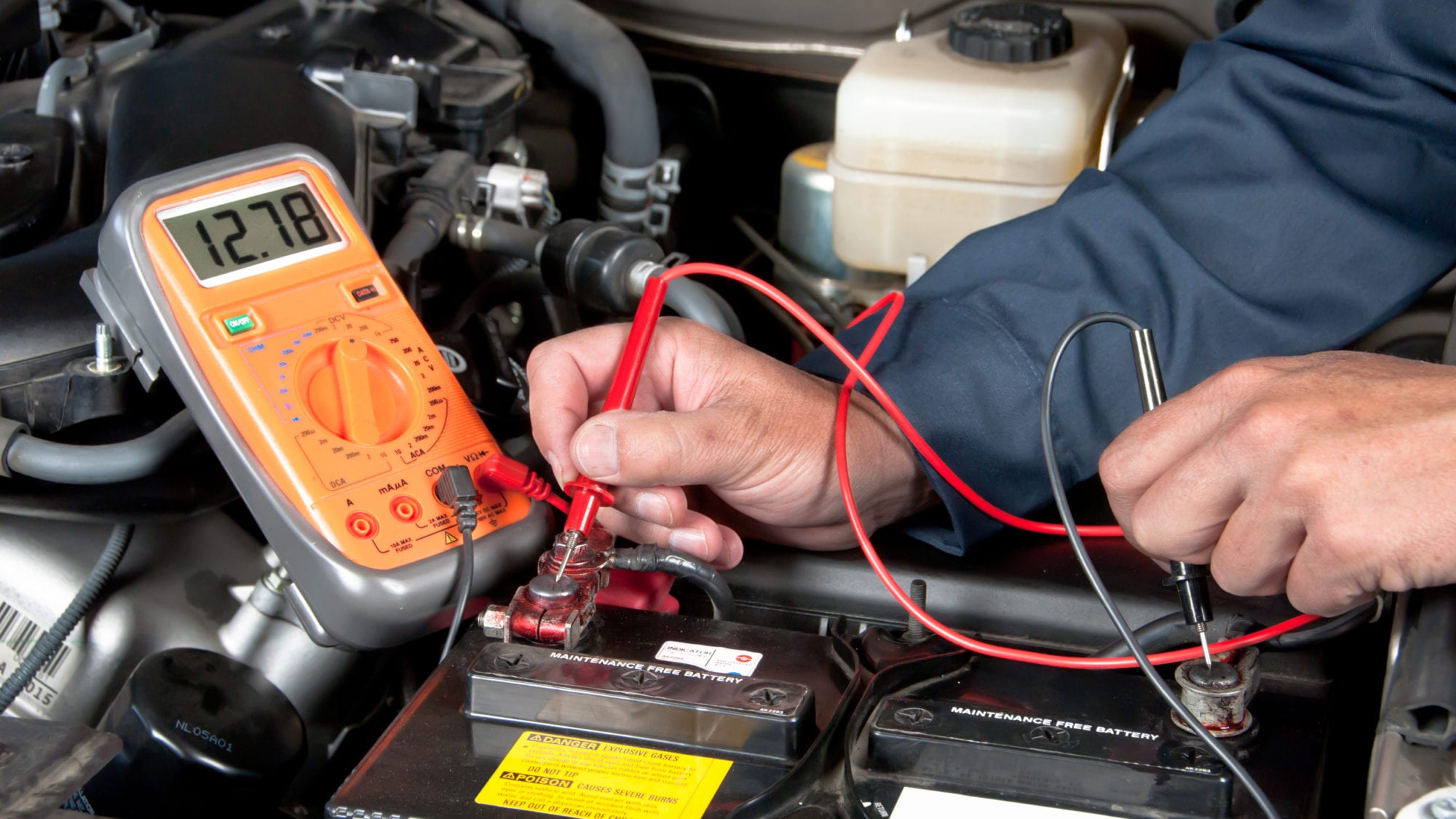 A battery's voltage being checked