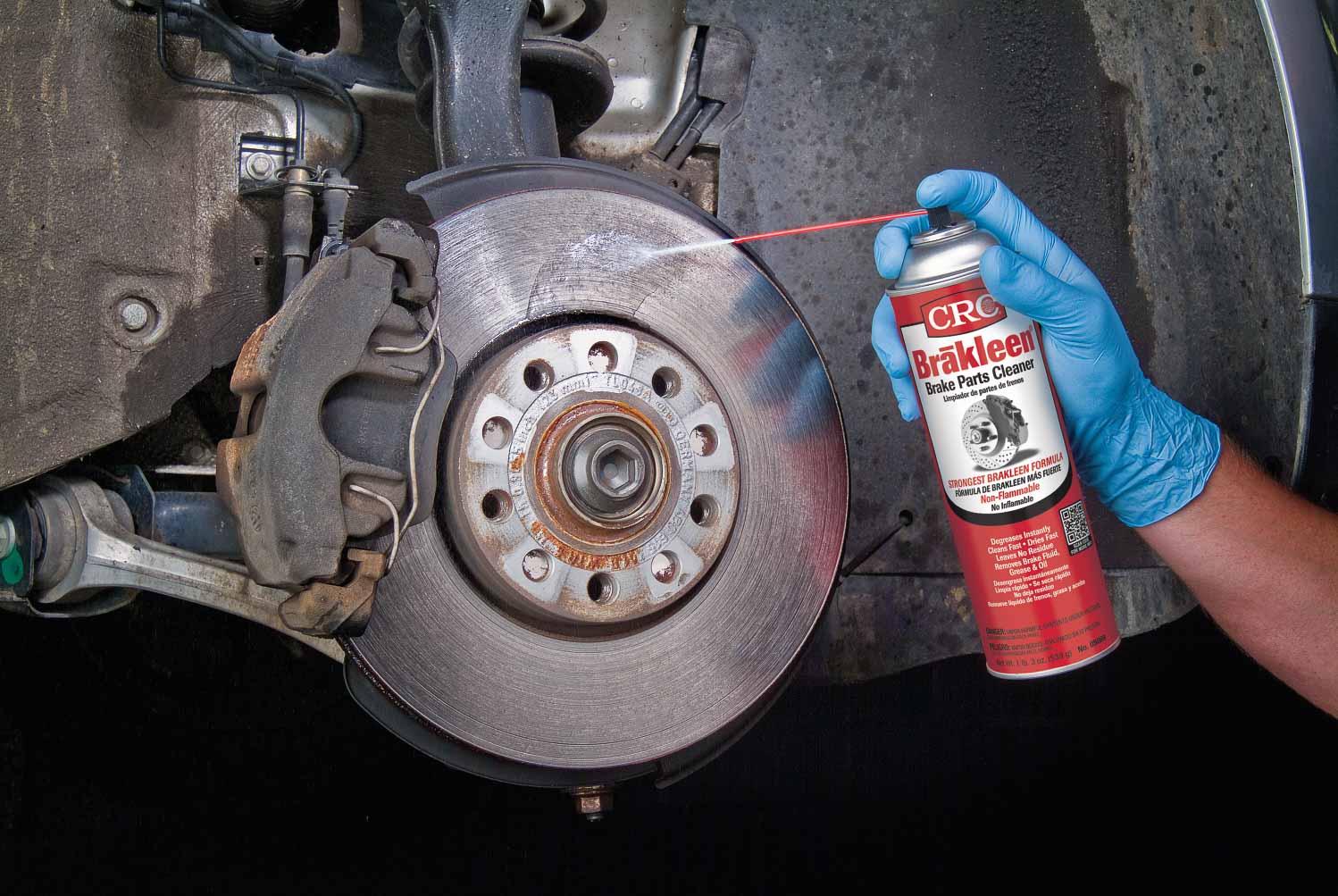 A man using brake cleaner