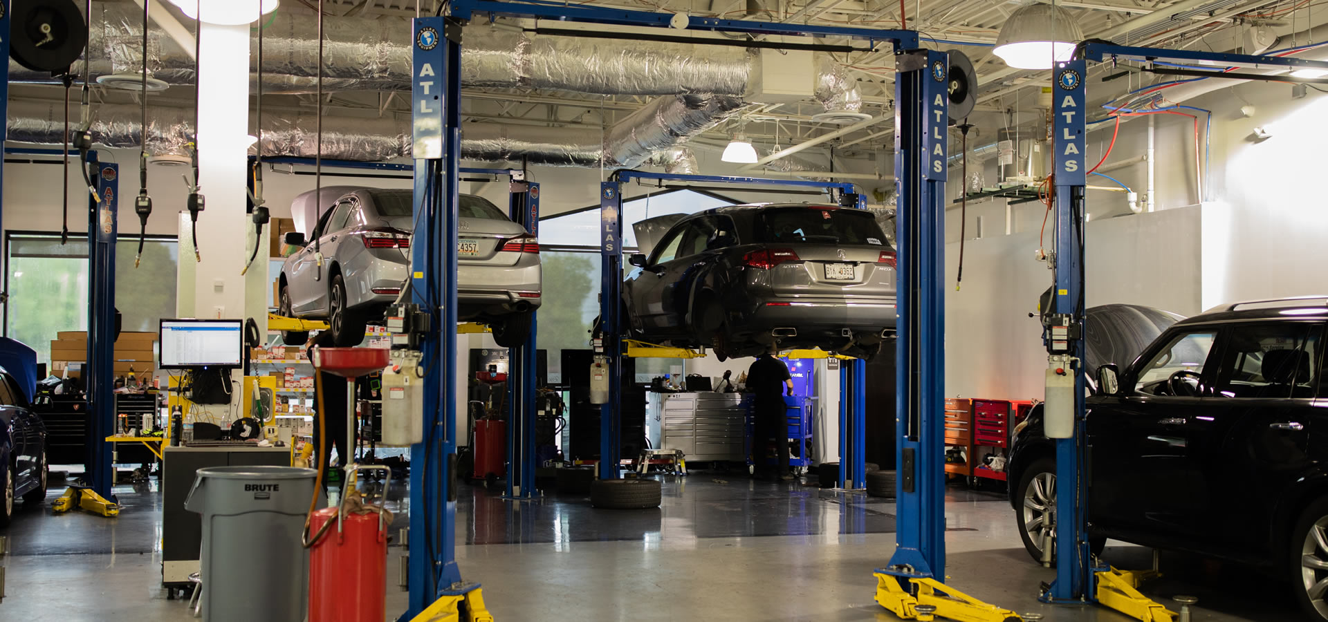 Two vehicles on a lift