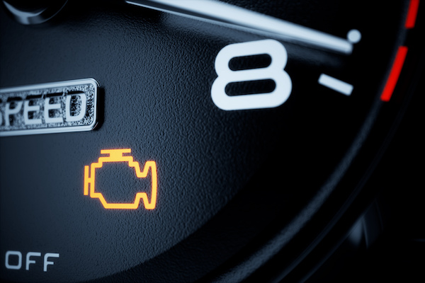 Closeup of a vehicle's illuminated check engine light