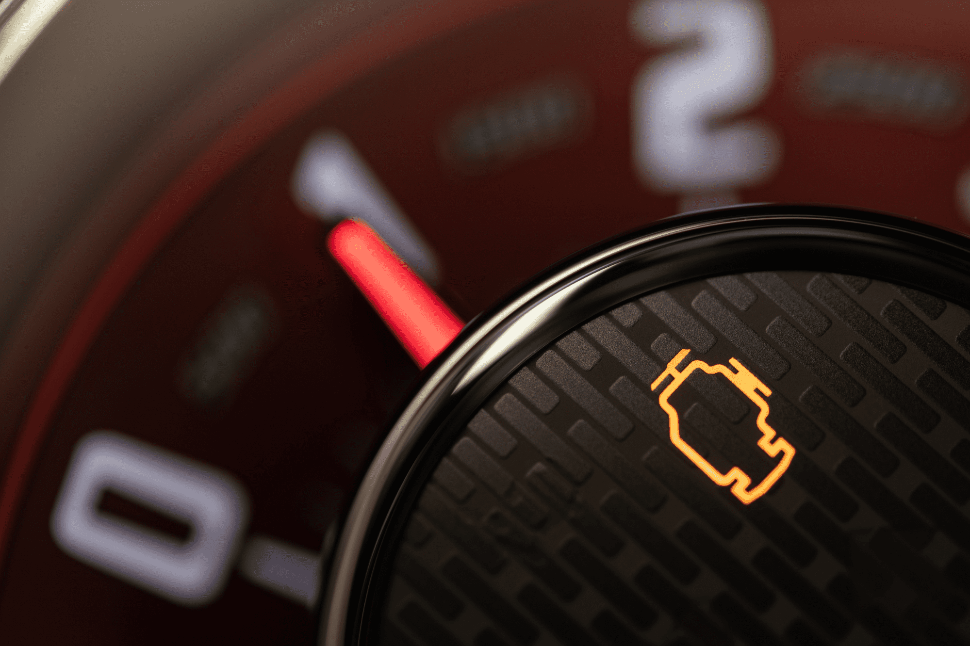 Closeup of a vehicle's illuminated check engine light