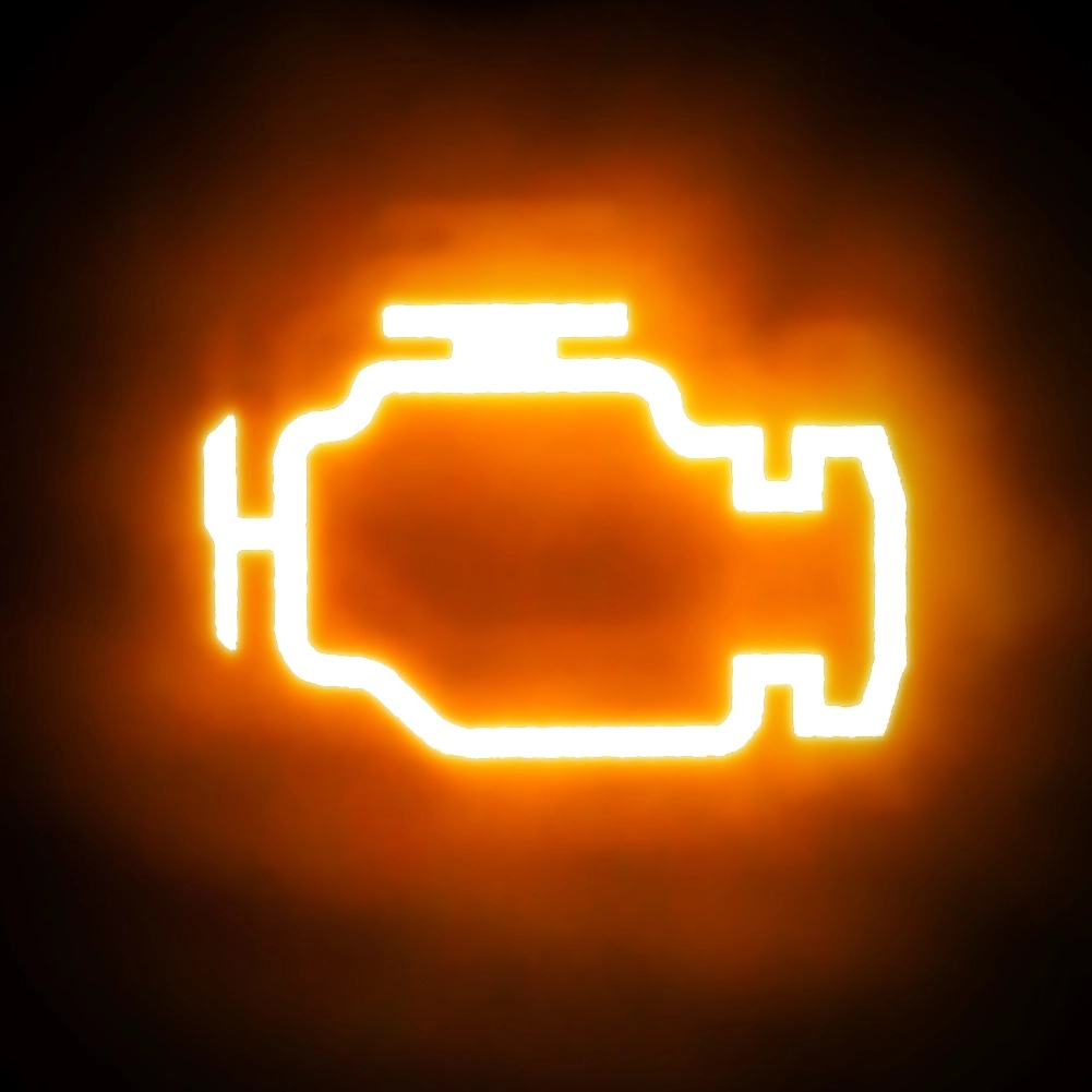 Extreme closeup of a vehicle's illuminated check engine light