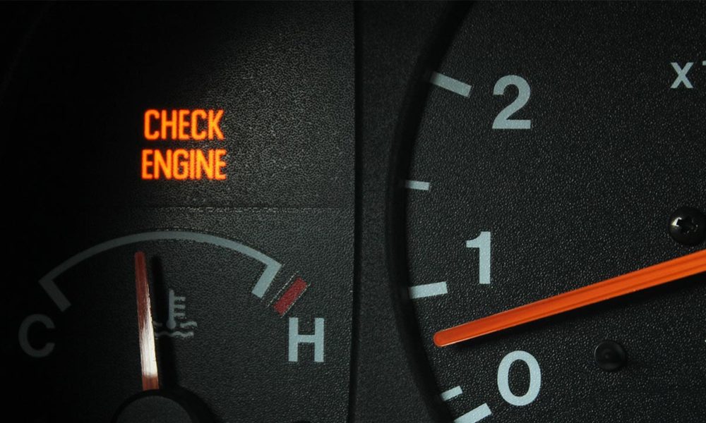 Closeup of a vehicle's illuminated check engine light