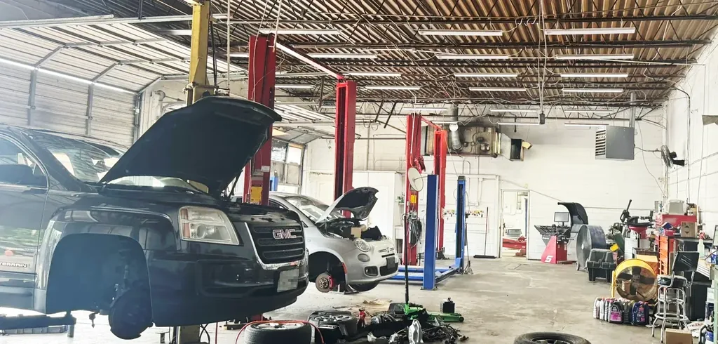 Inside the Beach Auto & Transmission Repair service bay with lifts and tools