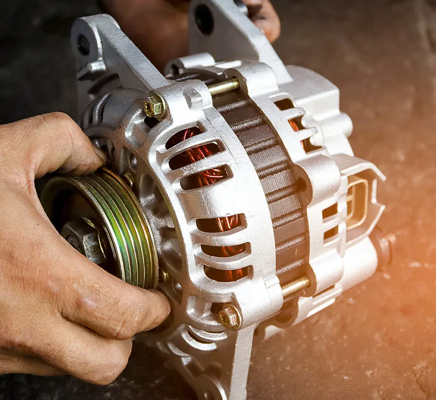Close-up of an alternator being tested and serviced in a Virginia Beach auto repair shop